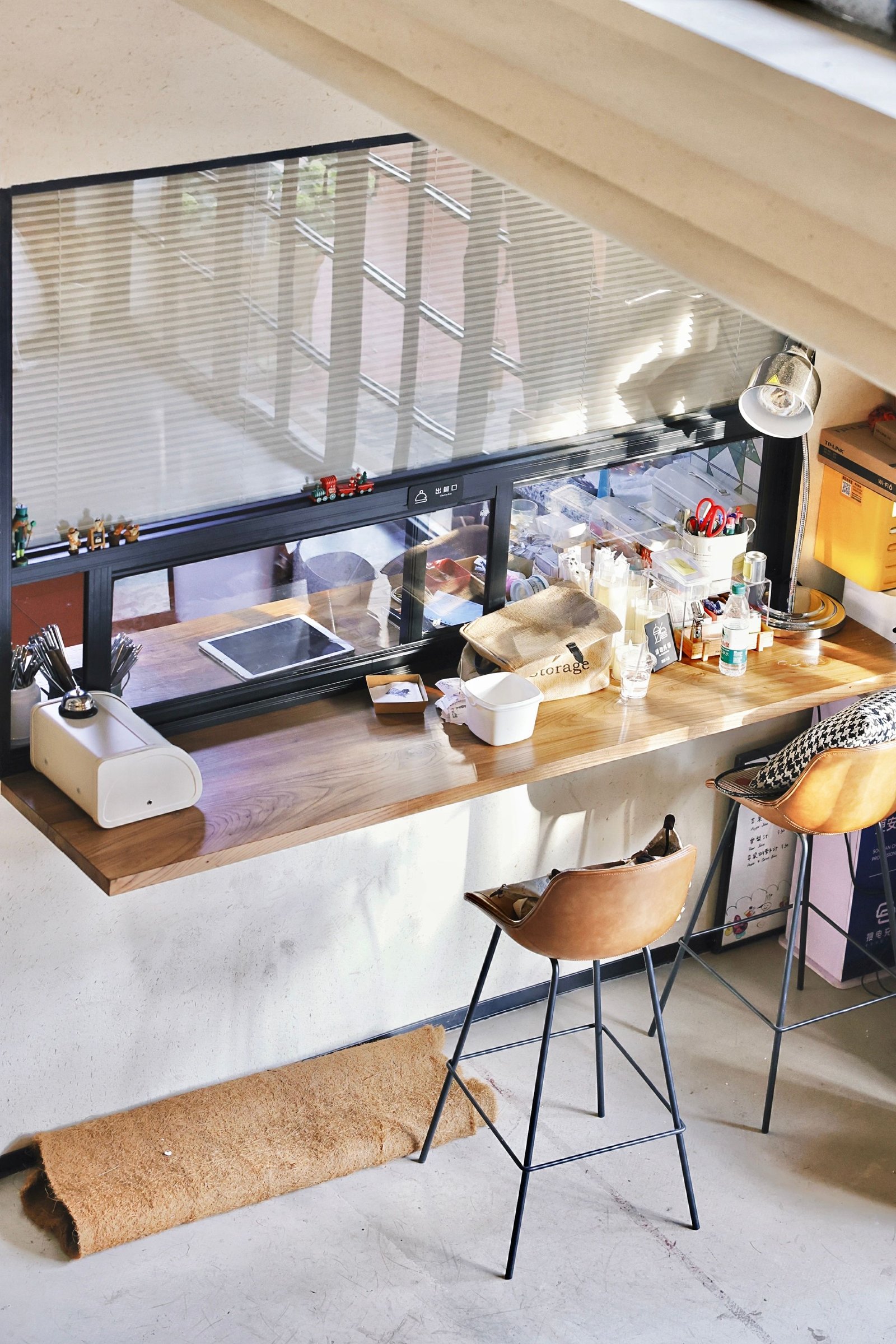 A bright contemporary café with a barista at the counter