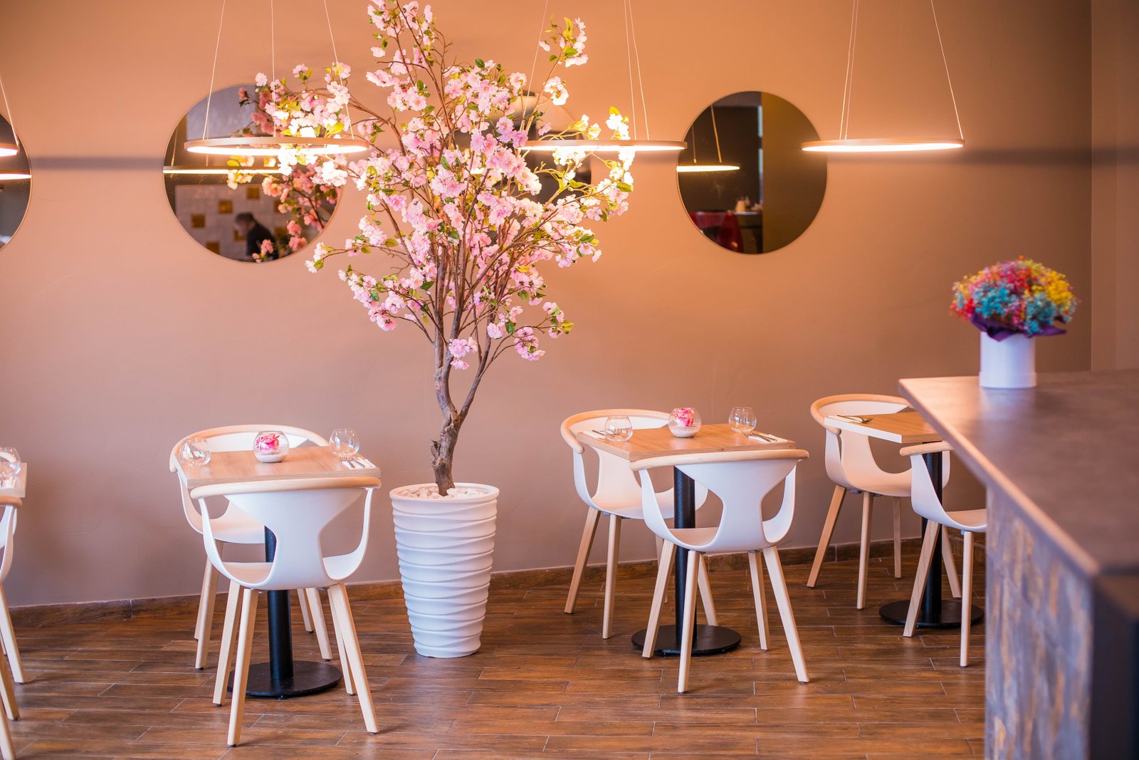 A warmly lit restaurant table set for dinner
